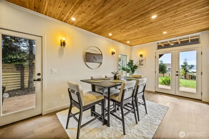 One could have a larger table and buffet here and enjoy the views from the french doors while dining!