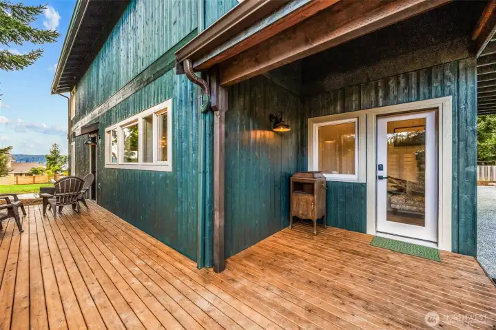 Covered back entry and side deck on South & East side of home.