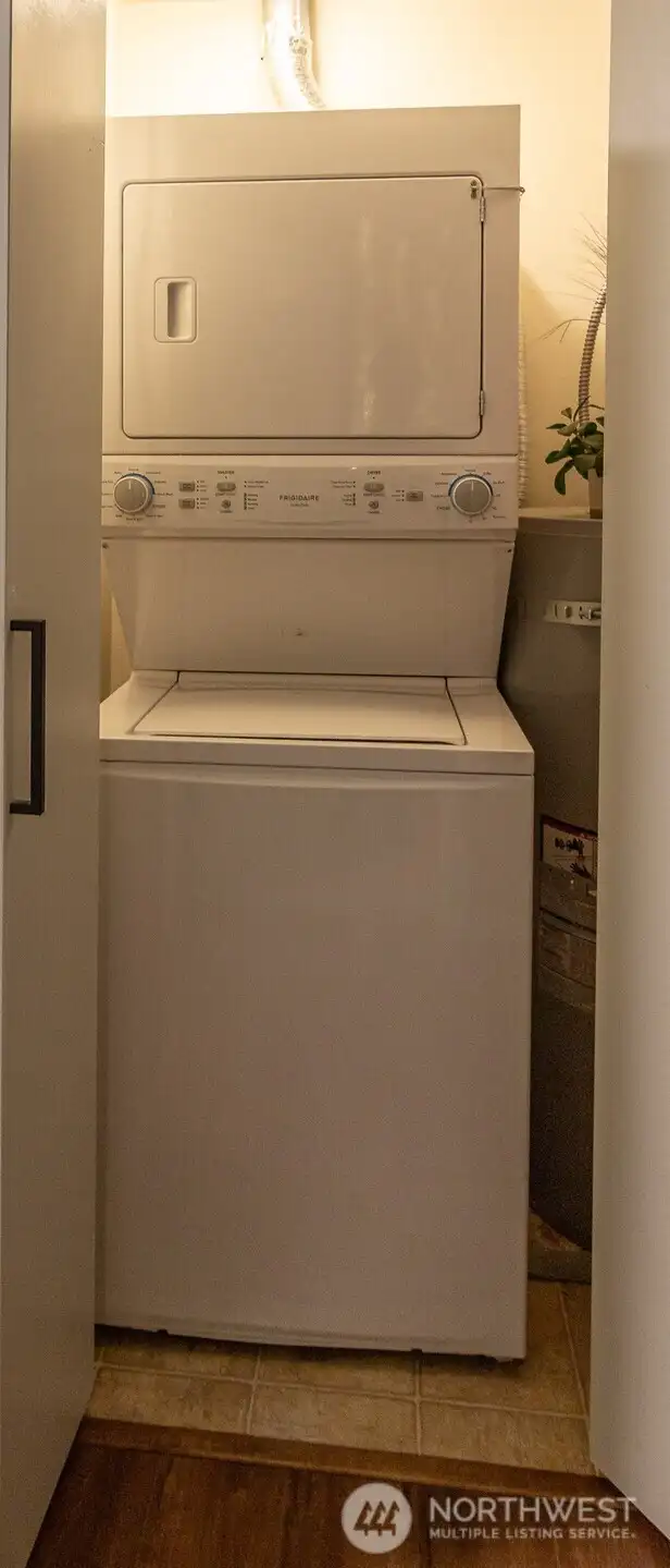 The convenient laundry closet is located just outside the bedrooms.
