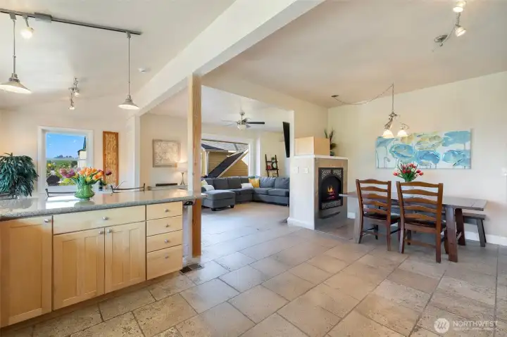 Looking from the kitchen, at the dining room space. An entertainers dream with a double-sided fireplace and wide open space.