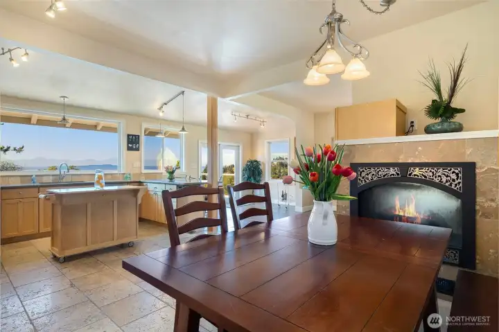Sitting at the dining room table, looking towards the kitchen, and of course the mountain and sound views are still breathtaking. Not a bad seat in the house.