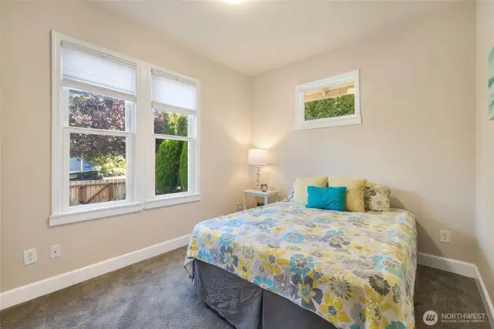 Main floor bedroom is spacious and bright