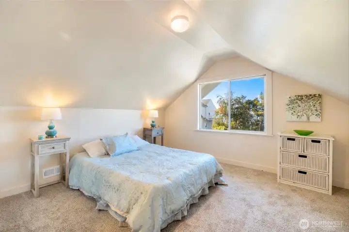 Primary bedroom upstairs with new carpet throughout and fresh paint.  The most incredible view, just imagine a possible dormer here…