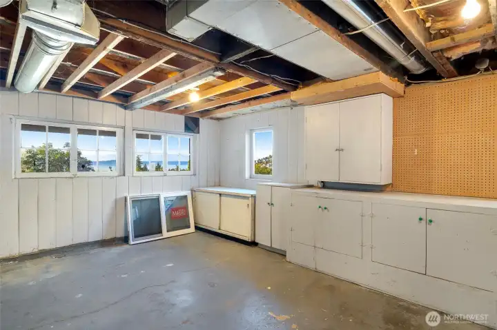 See the view!  Seller has some supplies, windows, kitchen cabinets, upstairs flooring.  There are many extras if you want to expand on what was started.