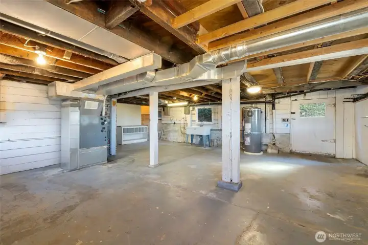 Another great angle of the open basement. The wide door can be accessed from the front yard, which would make a great mother-in-law or ADU entrance.   Step out to the patio and green space.   All with views of course.