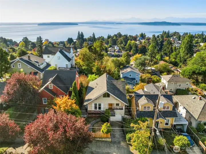Front drone shot of the home.   Walk to Beach Drive!