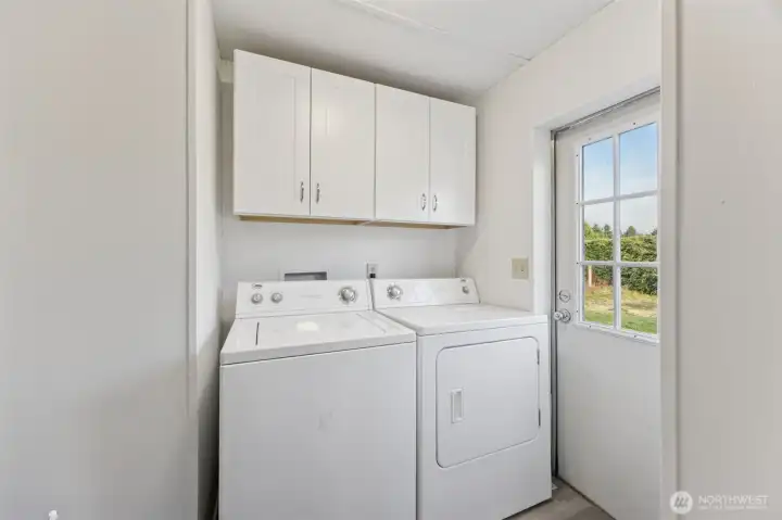 Washer/dryer included.  More new cabinets/storage and access to the back yard and patio.