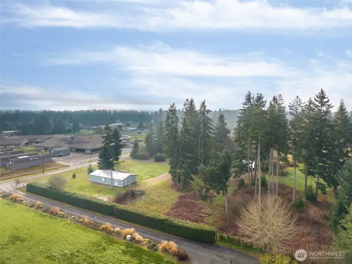 Another aerial view of the property with East Olympia Elementary in the background.