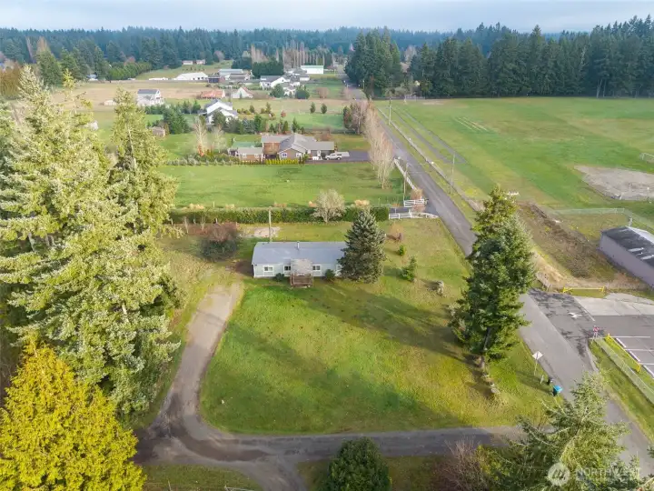 Entrance driveway off 87th to both the home and the separate RV site.