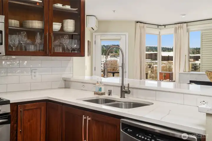 Newer hardwood cabinets with quartz countertops