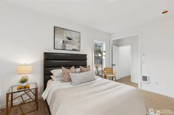 Primary bedroom on the main floor with ensuite bathroom, walk-in closet.