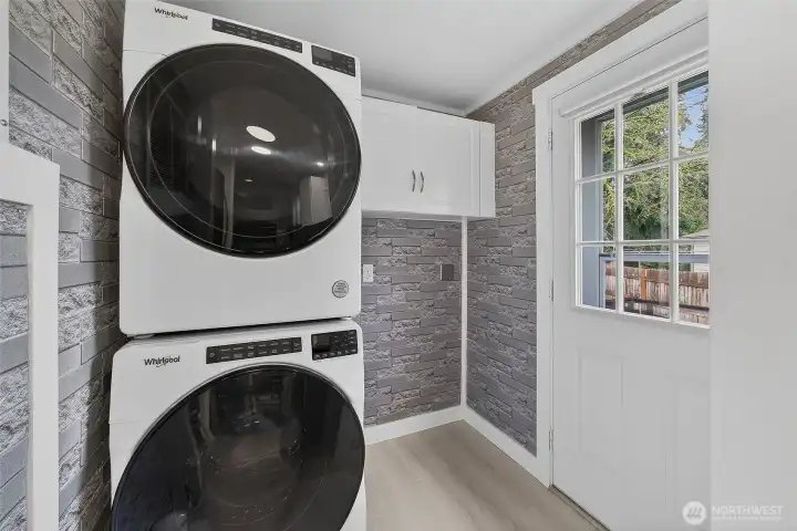 A full-size, stackable front-loading washer and dryer adds everyday convenience