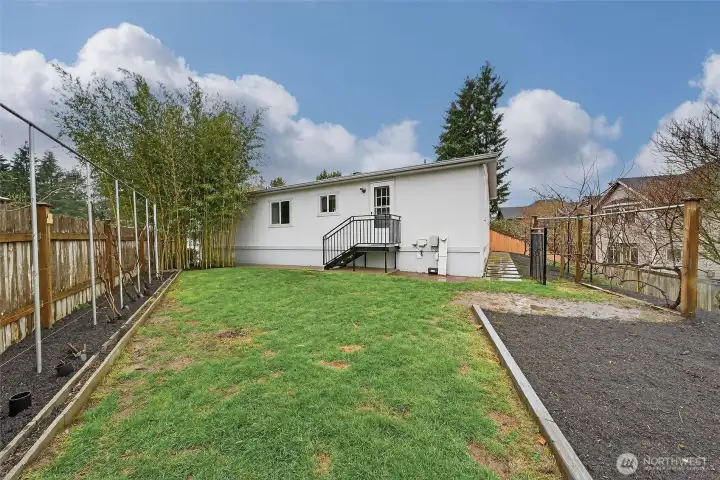 A spacious yard ready for gardening, gathering, or simply enjoying a quiet moment outdoors.