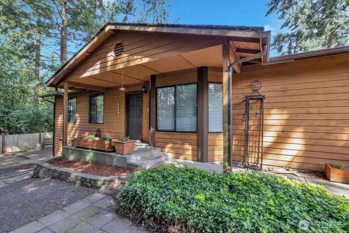 Follow the sidewalk through the gate to the covered, formal entry into the home. This fully fenced yard is your own private oasis. Room for Play Area, Big Toys, Dog Run, Garden beds -you decide. Deck off back of home has access from inside and out. Sit back here and just enjoy nature and all its beauty.