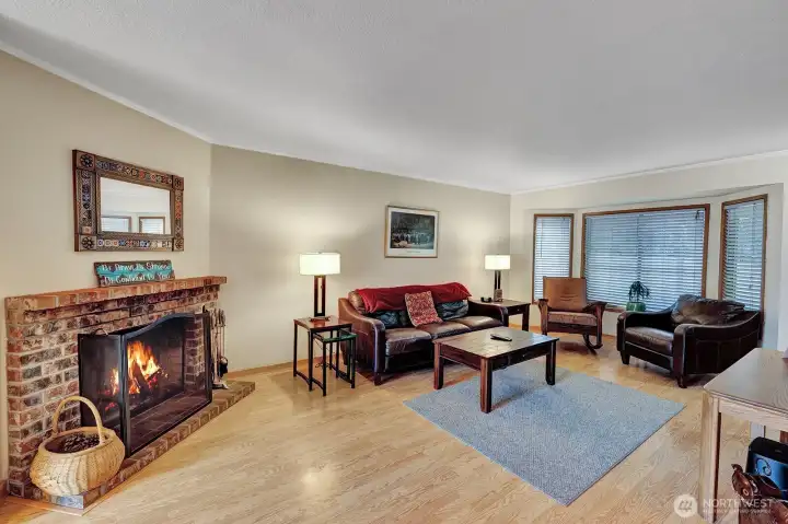 Beautiful brick fireplace with mantle and hearth. Great place to cozy up on those chilly Washington days!