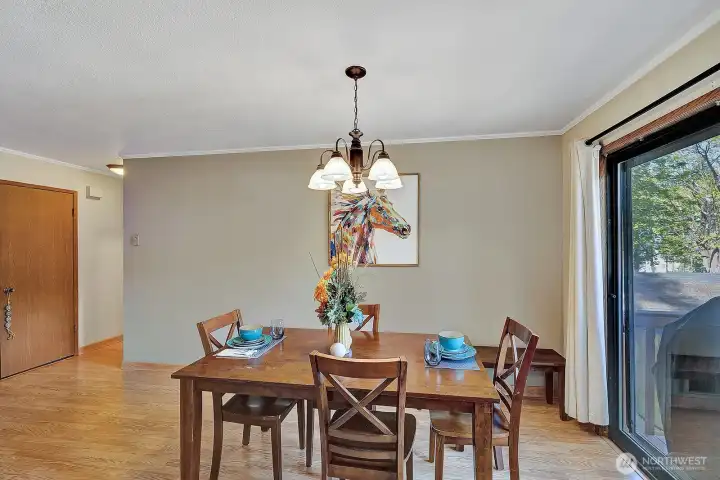 Formal dining room well easily accommodate a 6 -8-person table setting. Slider just steps to the private deck. Great space for barbequing or just enjoying the outdoors.