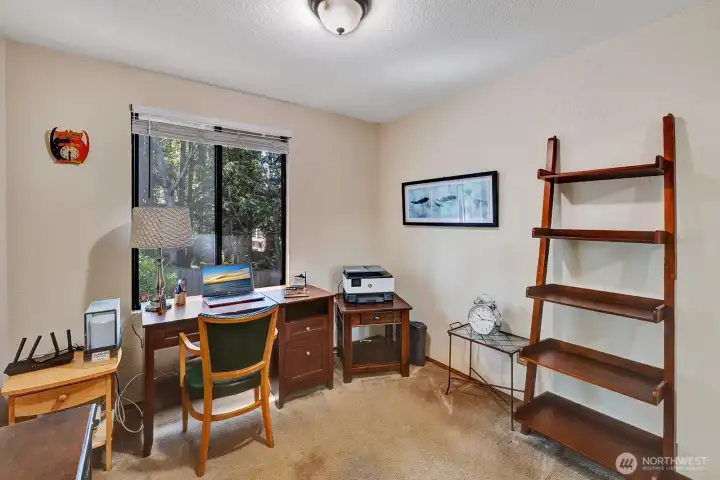 #2 guest bedroom being used as an office. Enjoy the view of the private yard or just let the natural light in for your convenience.