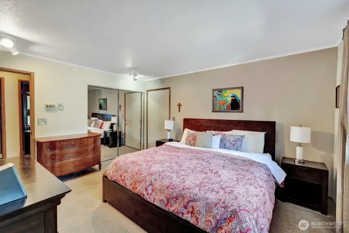 Primary bedroom is at the back of the house. Room for king/ double size bed and additional furniture. Mirrored closets. Large picture window brings in ample lighting.