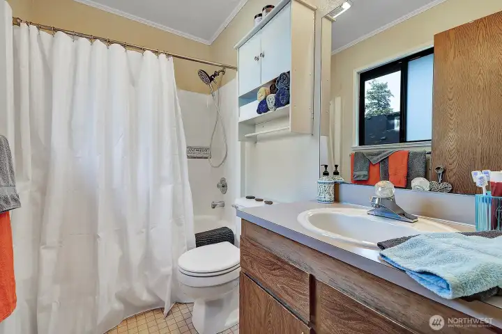 Private, 3-piece primary bath for your comfort.  Vanity with storage space for all your personal items.