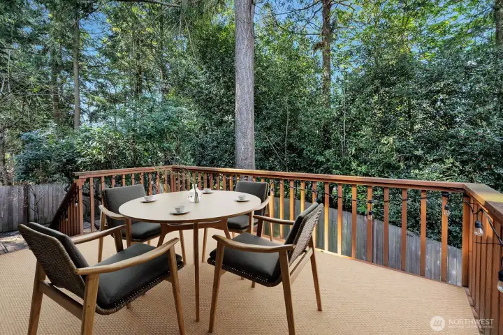 Back deck is a great place to relax and unwind. Privacy plus!!!  Virtually staged.