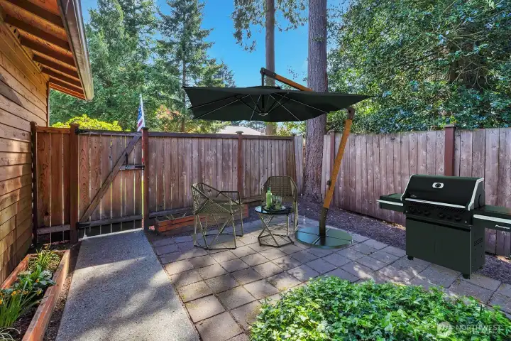 Gated entry from the driveway-street in this super private and quite location. Fully fenced. Pavers and cement tiles are low maintenance. Easy care yard with plants, shrubs, trees that border the home with year round greenery. Virtually staged.