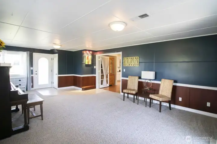 Spacious formal living room with fresh paint and new carpet