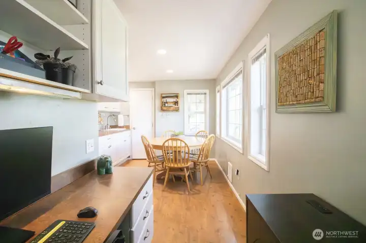 Office space tucked behind the kitchen w/ view of the breakfast nook
