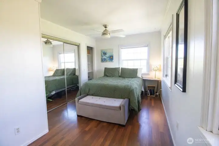 Bright bedroom with hardwood floors and flexible layout