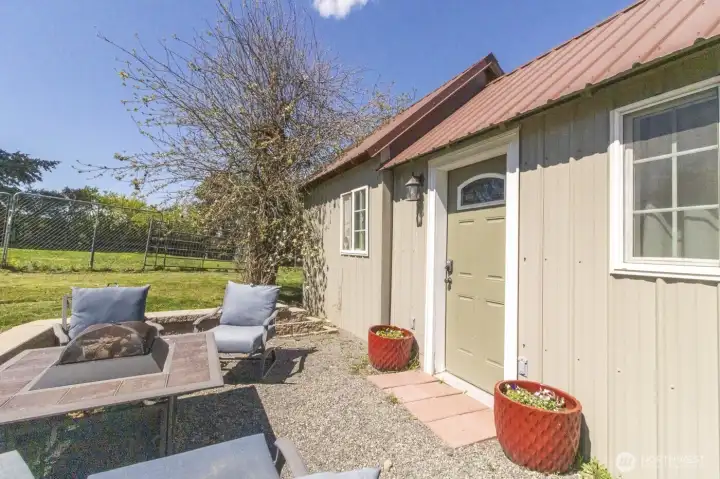 Exterior view of the detached Airbnb/guest quarters with an inviting patio