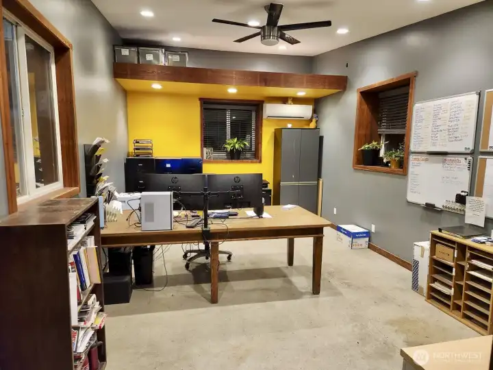 Finished heated office space with custom built-ins and workspace flexibility
