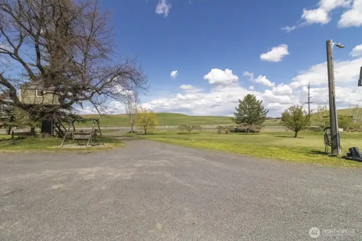 Wide driveway/parking area with easy access for trailers, equipment, or guests