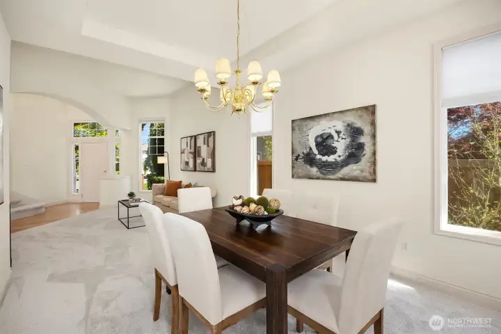 Seamless flow between formal living and dining spaces, enhanced by refined archways and classic columns.