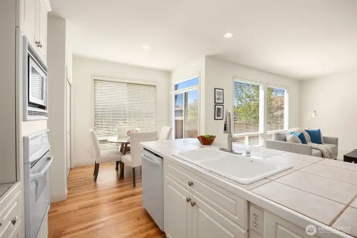 Well-placed island sink oriented toward the living room, enhancing flow and functionality for entertaining.