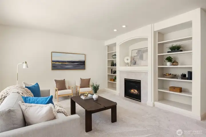 Gather in the cozy family room, where a fireplace and built-in shelving create a warm, inviting focal point.