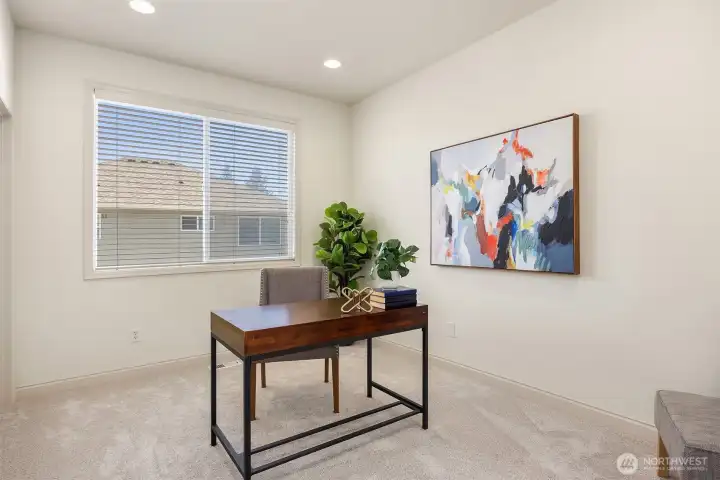 The main-floor bedroom offers a convenient place for guests or office space with a 3/4 bathroom adjacent to it.