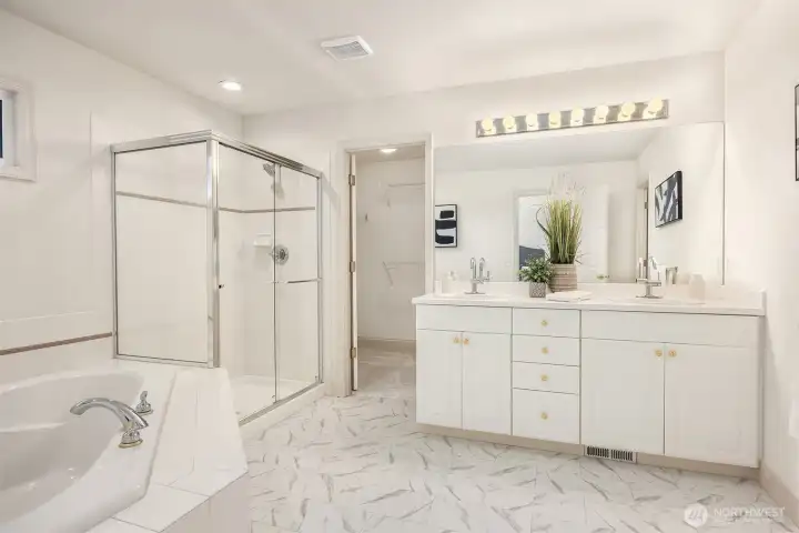 Start and end your day in a bright primary en-suite with a spacious five-piece bath and plenty of storage to stay organized.