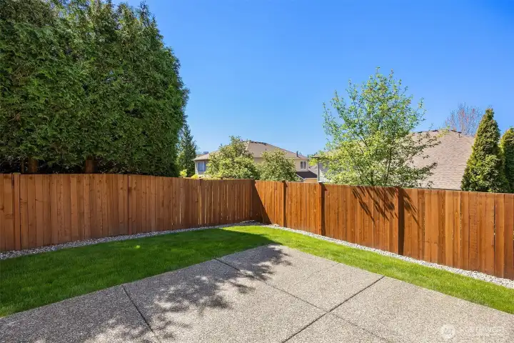 Outside, the fully fenced, easy-to-maintain yard is perfect for outdoor entertaining.
