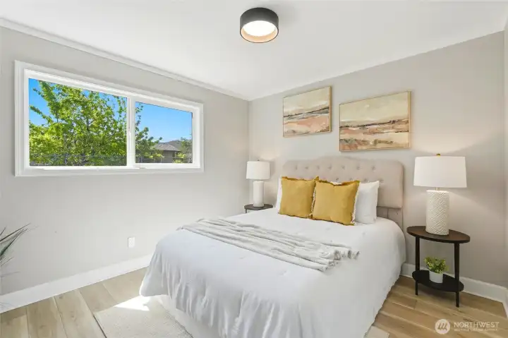 Each bedroom offers a fresh, comfortable, and updated feel.  New flooring and paint create a cohesive, modern look throughout.