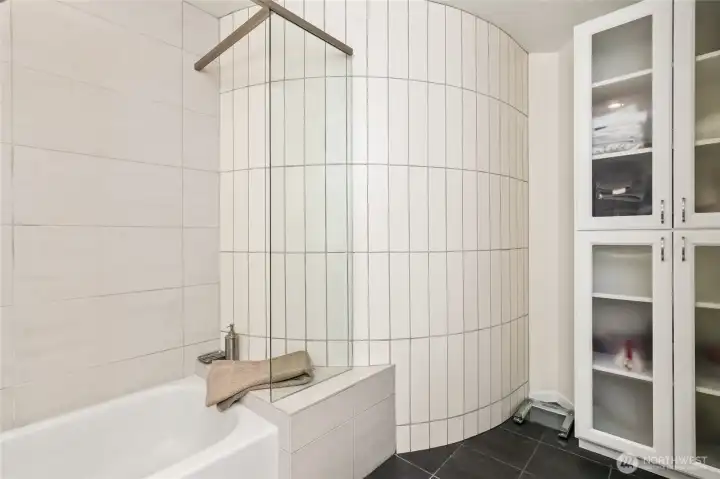 Bath with Curved Tiled Wall