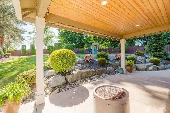 Enjoy morning coffee, evening conversations, and year-round gatherings beneath this beautifully finished covered patio.