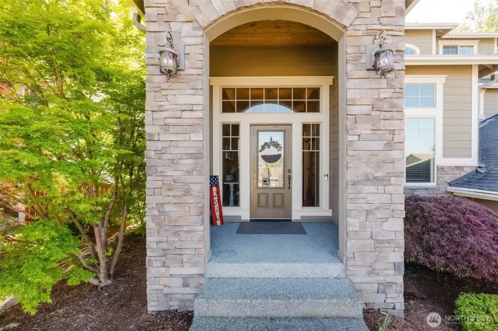 Step through the grand covered entry and discover the quality craftsmanship carried throughout the home.
