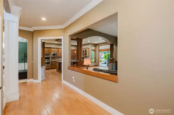 Rich wood accents and open sightlines connect the home's gathering spaces while maintaining warmth and character.