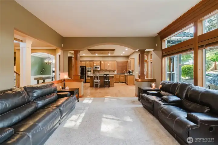 Designed for connection and conversation, this inviting layout keeps family and guests comfortably together while maintaining distinct living spaces.