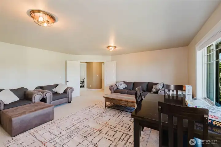 The expansive bonus room offers endless flexibility as a media room, game room, home theater, playroom, or multi-generational living space.