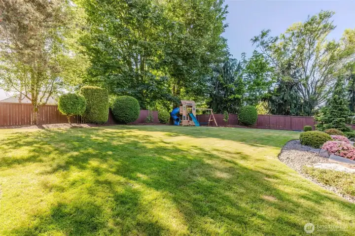 A large fenced yard offers endless possibilities for play, pets, gatherings, and outdoor enjoyment.