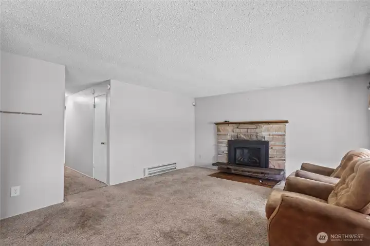 Cozy gas fireplace warms the room.