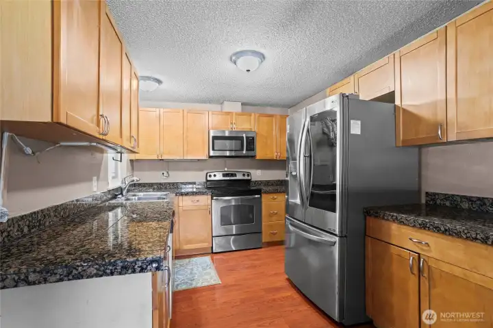 Granite tiles and Stainless Steel appliances.