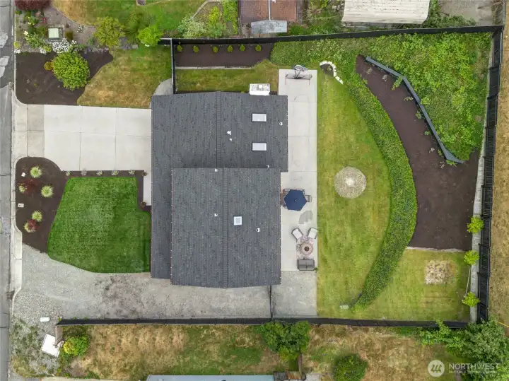 The 9,600 sq ft lot provides rare depth for the neighborhood — room for a basketball hoop, garden terraces, fire pit area, and a lawn that actually absorbs outdoor life. The 9,600 sq ft lot provides rare depth for the neighborhood — room for a basketball hoop, garden terraces, fire pit area, and a lawn that actually absorbs outdoor life.
