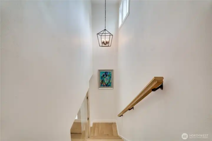 Whitewashed oak stair treads with brass bracket hardware — every transition in this home is finished with the same intentional design detail. Whitewashed oak stair treads with brass bracket hardware — every transition in this home is finished with the same intentional design detail.