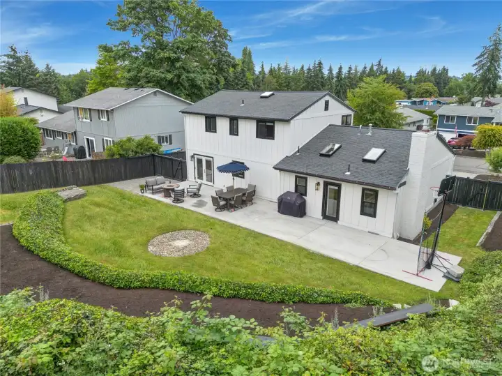Aerial view confirms what the lot survey shows — fully fenced front and rear, RV parking, concrete patio, and a new roof installed by the current owner. Aerial view confirms what the lot survey shows — fully fenced front and rear, RV parking, concrete patio, and a new roof installed by the current owner.